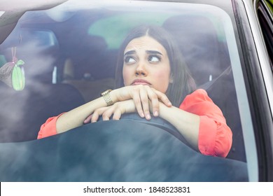 Stressed Woman Driver Sitting Inside Her Car. Angry Female Driver Driving A Car. Angry Young Woman Stuck In A Traffic Jam. Woman Annoyed In Car. Girl Stuck In Traffic.