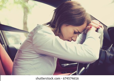 Stressed Woman Driver Sitting Inside Her Car 