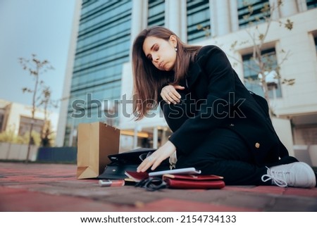 
Stressed Woman Dropping Her Bag and Belongings on the Sidewalk. Scatterbrained clumsy girl feeling dizzy and overwhelmed looking for her stuff
 Foto d'archivio © 