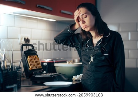 Stressed Woman Making Mistakes while Preparing Waffle Breakfast. Funny housewife bad at cooking staining her apron and failing at breakfast
