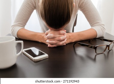 Stressed woman in a office setting.