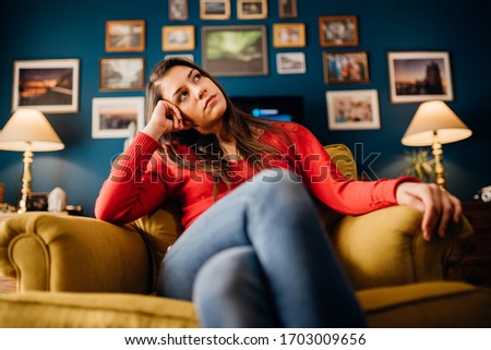 Stressed woman overthinking events alone at home.Thinking of problems/solution.Annoyed and bored at home.Impatience and anger for partner.Irritating behavior annoyance.Doubtful person