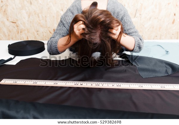 Stressed Woman Tailor Tousle Her Hair Stock Photo Edit Now 529382698