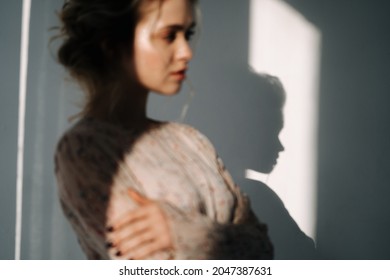Stressed Woman Think about Problem Blurred Photo. Sadness Serious Blonde Girl Thinking Something in Apartment Room. Charming Caucasian Lady in Stylish Dress Feeling Despair and Disappoint