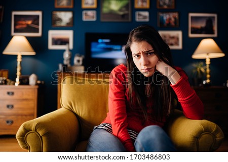 Stressed woman thinking of problems/solution.Annoyed and bored at home.Impatience and anger for partner.Irritating behavior annoyance.Doubtful disorder,indecisive person.Skeptic cynic personality