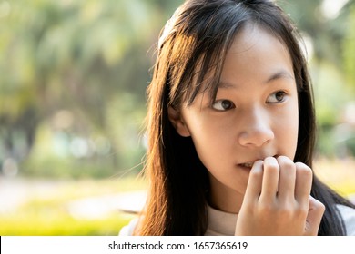 Stressed Worried Child Girl Bites Finger Nails,female People With Nail Biting,feel Anxious,woman With Hand On Mouth Biting Her Nails,risk Of Bringing Germs Into The Body,anxiety,psychiatric Problems