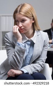 Stressed Young Applicant Sitting On Couch And Waiting For Her First Job Interview