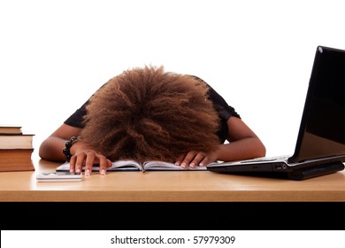 Stressed Young Black Woman,  Sitting At A Table Among Books And Laptop On A White Background.