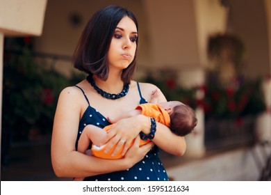 Stressed Young Mother Calming Her Baby. Anxious New Mom Holding Her Newborn In Her Arms
