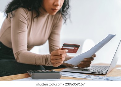 Stressed young woman has financial problems with credit card debt to pay crucial show concept of bad personal money and mortgage pay management crisis. - Shutterstock ID 2396359167