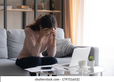 Stressed Young Woman Sit At Home Manage Household Finances Frustrated With Family Financial Problems, Distressed Upset Female Disappointed With Money Debt, Pay Bills Taxes Online On Computer