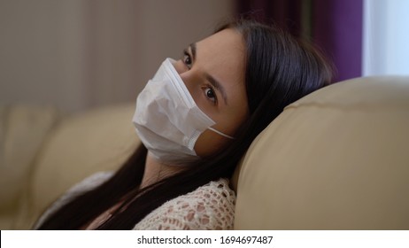 Stressed Young Woman Thinking Of Health Problems. Sadness Young Woman Having Depression Due To Coronavirus Outbreak. Quarantine Covid-19 Corona Virus. Social Distancing Concept