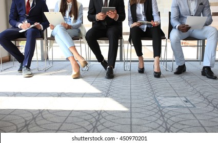 Stressful people waiting for job interview - Shutterstock ID 450970201