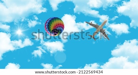 Stretch ceiling decoration image. Bottom up view of passenger plane, hot air balloon and beautiful tropical sunny sky. 