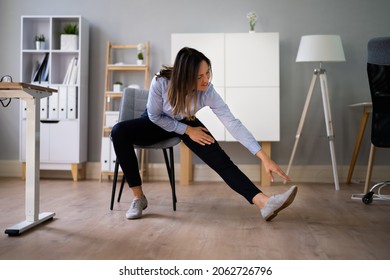 Stretch Exercise Workout Near Office Desk. Worker Stretching - Powered by Shutterstock