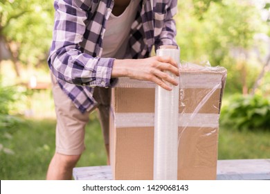 Stretch Wrap Roll, Man Packing The Box For Shipping