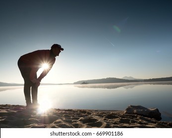 Stretching After Jogging. Middle Age Sports Man Do Stretching Pose And Deep Breath. Outdoor Training At Offshore, People And Lifestyle Concept.