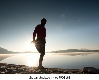 Stretching After Jogging. Middle Age Sports Man Do Stretching Pose And Deep Breath. Outdoor Training At Offshore, People And Lifestyle Concept.