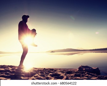 Stretching After Jogging. Middle Age Sports Man Do Stretching Pose And Deep Breath. Outdoor Training At Offshore, People And Lifestyle Concept.