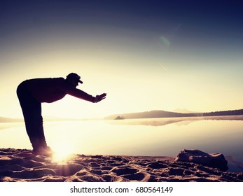 Stretching After Jogging. Middle Age Sports Man Do Stretching Pose And Deep Breath. Outdoor Training At Offshore, People And Lifestyle Concept.