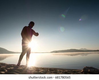 Stretching After Jogging. Middle Age Sports Man Do Stretching Pose And Deep Breath. Outdoor Training At Offshore, People And Lifestyle Concept.