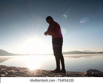 Stretching After Jogging. Middle Age Sports Man Do Stretching Pose And Deep Breath. Outdoor Training At Offshore, People And Lifestyle Concept.