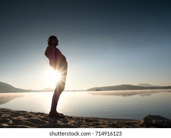 Stretching After Jogging. Middle Age Sports Man Do Stretching Pose And Deep Breath. Outdoor Training At Offshore, People And Lifestyle Concept.