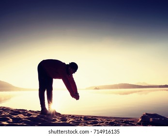 Stretching After Jogging. Middle Age Sports Man Do Stretching Pose And Deep Breath. Outdoor Training At Offshore, People And Lifestyle Concept.