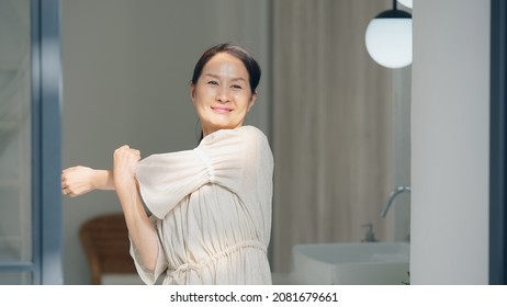 Stretching Asian senior woman. Body care. Anti aging. Gymnastics. - Powered by Shutterstock