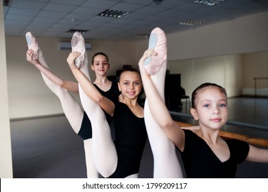 Stretching, Children In Ballet Dance Class.