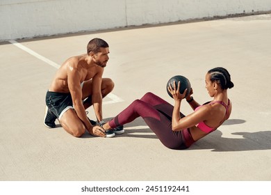 Stretching, fitness and woman with medicine ball, practice and training with coach, exercise and health. Outdoor, workout and personal trainer with person, class and performance for sports and body - Powered by Shutterstock