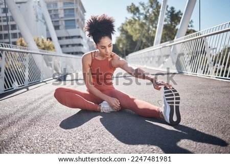 Stretching legs, fitness and black woman on city bridge for exercise, running or training in sports shoes fashion. Warm up, focus and urban athlete on ground workout for body, muscle and health goals