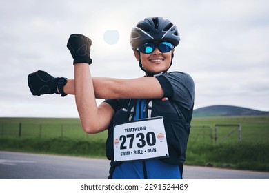 Stretching, triathlon and cycling with woman in road for training, competition and workout. Warm up, fitness and exercise with female cyclist in nature ready for performance, summer and marathon - Powered by Shutterstock