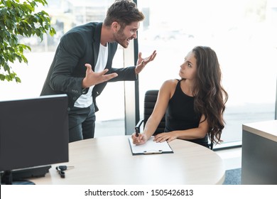 Strict Boss Man Swearing At Employee Woman For Bad Work At The Workplace Looking Angry
