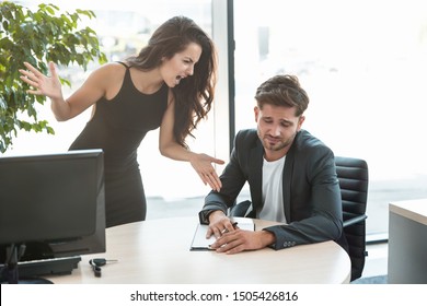 Strict Boss Woman Shouting At Depressed Employee Man For Bad Work At The Workplace Looking Angry