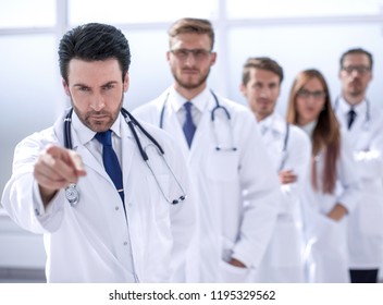 Strict Doctor, Pointing At You, Standing In The Workplace