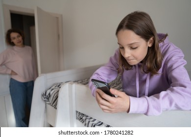 Strict Mother Lecturing Teenage Daughter For Long Smartphone Use, Child And Gadgets Concept, Overuse, Teen Girl Holding Phone, Looking At Screen, Chatting In Social Network, Playing Mobile Game