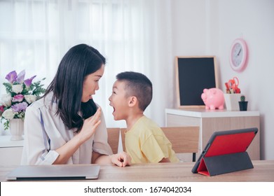 Strict Mother Scolding Little Son For Long Tablet Use And Kid Ignoring Not Listening To Mother In The Room,parent Reprimanding