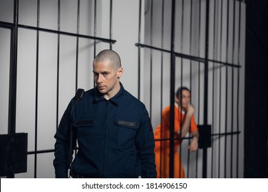 A Strict Prison Guard In Uniform Guards Cells With Prisoners In A Maximum Security Prison