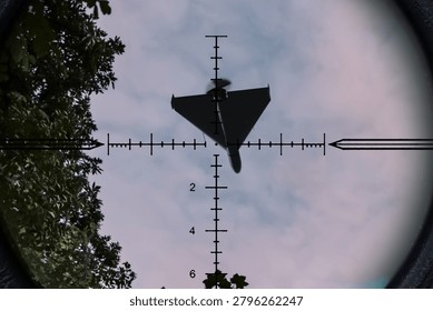 Strike drone appears in optical scope crosshair against sky and trees background