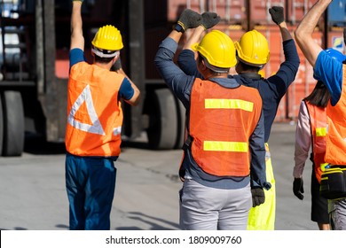 Strike of workers in container yard. Group of multiethnic engineer people during a protest in workplace