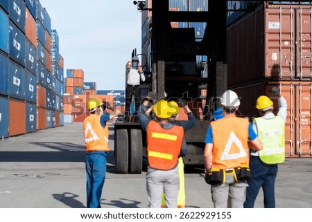 Strike of workers in container yard. Group of multiethnic engineer people during a protest in workplace