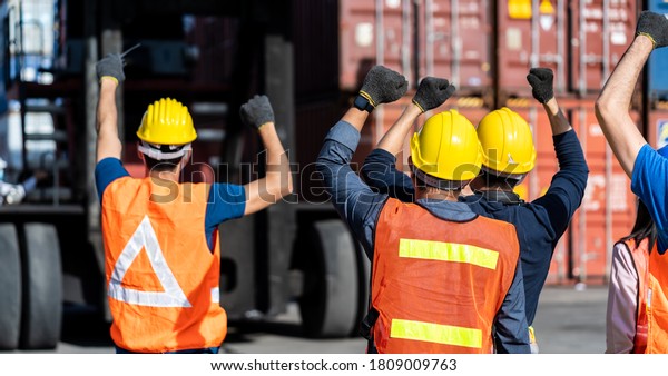 Strike of workers in\
container yard. Group of multiethnic engineer people during a\
protest in workplace
