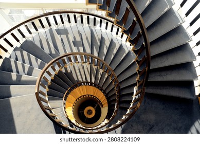 A striking architectural perspective captures the mesmerizing, hypnotic rhythm of a circular stairwell design.