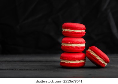 A striking display of vibrant red macarons arranged elegantly on a dark surface, emphasizing their rich color and delicate texture. - Powered by Shutterstock