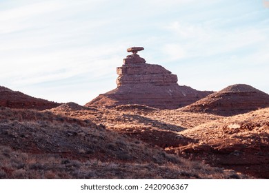 Striking photo of the iconic Mexican Hat rock formation. Nature's sculpture stands in bold contrast against the desert landscape, a testament to the geological wonders found in the American Southwest.