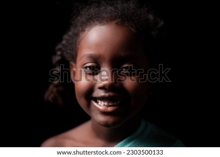 Similar – Image, Stock Photo Dramatic portrait of Black adult man looking up into spotlight while standing on stage in theater with low light copy space