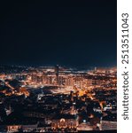 A striking vertical view of Belgrade at night, highlighting the city’s illuminated streets and landmarks. Ideal for urban, travel, and nighttime photography projects.

