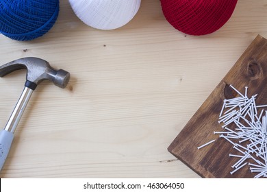 String Art Crafts On A Wooden Background