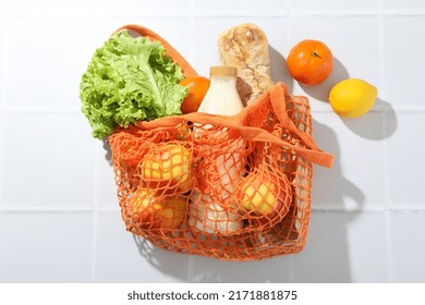 String Bag With Grocery On Tile Background